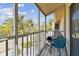 Balcony featuring a seating area and screened-in views of the surrounding community at 9012 Antigua Dr, Seminole, FL 33777