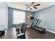 Blue bedroom featuring a treadmill and a ceiling fan at 9012 Antigua Dr, Seminole, FL 33777