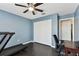 Blue bedroom featuring a treadmill, a closet and a ceiling fan at 9012 Antigua Dr, Seminole, FL 33777