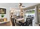 Dining area with seamless flow into the kitchen and sliding glass door access to the back patio at 9012 Antigua Dr, Seminole, FL 33777