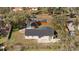 Rear aerial view of the property highlighting fenced backyard and patio area at 934 W Wheeler Rd, Brandon, FL 33510