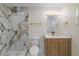 Bright bathroom featuring white marbled shower and modern finishes and fixtures at 934 W Wheeler Rd, Brandon, FL 33510