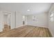 Spacious bedroom with wood floors, neutral paint, and barn door detail; ample natural light at 934 W Wheeler Rd, Brandon, FL 33510