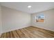 Bedroom with wood-style floors and natural light from a window, creating a calming and inviting atmosphere at 934 W Wheeler Rd, Brandon, FL 33510