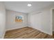 Bedroom featuring wood flooring and a closet, perfect for relaxing and unwinding after a long day at 934 W Wheeler Rd, Brandon, FL 33510