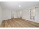 Spacious main bedroom featuring wood flooring, a large closet and an attached bath with modern sliding doors at 934 W Wheeler Rd, Brandon, FL 33510