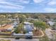 Wide aerial shot of a residential area with houses, green trees and landscaping at 9394 117Th Ave, Largo, FL 33773