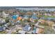 Picturesque neighborhood shot from above reveals homes with easy water access in a verdant community at 9394 117Th Ave, Largo, FL 33773