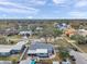 Scenic aerial view of a community with manicured lawns, mature trees, and waterfront access at 9394 117Th Ave, Largo, FL 33773