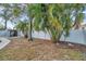 The backyard offers privacy with mature landscaping and a shed for extra storage space at 9394 117Th Ave, Largo, FL 33773