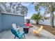 This backyard features a fire pit and colorful chairs, perfect for relaxing with friends and Gathering at 9394 117Th Ave, Largo, FL 33773