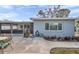 A view of the house exterior highlighting the screened in porch and outdoor space at 9394 117Th Ave, Largo, FL 33773