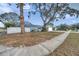 Mature trees adorn the front yard of this traditional home at 9394 117Th Ave, Largo, FL 33773