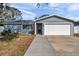 Charming single-story home features a well-manicured lawn and an attached two-car garage at 9394 117Th Ave, Largo, FL 33773