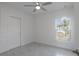 Bedroom featuring neutral paint, tiled floors, closet and window allowing natural light at 1018 Blakley St, Punta Gorda, FL 33980