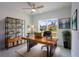 Modern home office with a large desk, ample storage, and a window offering a serene view at 1018 Blakley St, Punta Gorda, FL 33980