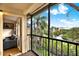 Screened balcony with furniture overlooking tropical landscape and pond at 11901 4Th N St # 6303, St Petersburg, FL 33716