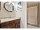 Bathroom with granite vanity top, wood cabinets and shower with curtain at 11901 4Th N St # 6303, St Petersburg, FL 33716