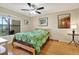 Cozy bedroom features a ceiling fan, and art at 11901 4Th N St # 6303, St Petersburg, FL 33716