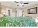 Bedroom featuring wood floors and doorways to the bathroom and hallway at 11901 4Th N St # 6303, St Petersburg, FL 33716