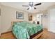 Bedroom featuring wood floors, neutral walls and a decorative ceiling fan at 11901 4Th N St # 6303, St Petersburg, FL 33716