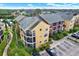 A view of the exterior of the property, including balconies and surrounding landscaping at 11901 4Th N St # 6303, St Petersburg, FL 33716