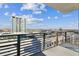 Balcony view of a nearby luxury high rise and cityscape under bright blue sky at 1208 E Kennedy Blvd # 1115, Tampa, FL 33602