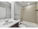 Bathroom with a shower and tub, a modern toilet and a single sink vanity at 1208 E Kennedy Blvd # 1115, Tampa, FL 33602