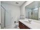 Bathroom with a tiled shower and a vanity with ample counter space and storage at 1208 E Kennedy Blvd # 1115, Tampa, FL 33602