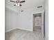 Neutral bedroom featuring tiled floors, a ceiling fan and access to bathroom at 1208 E Kennedy Blvd # 1115, Tampa, FL 33602