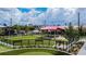 Exterior view of a fenced dog park with artificial turf and a covered seating area at 1208 E Kennedy Blvd # 1115, Tampa, FL 33602