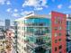 Modern condo building featuring balconies, floor-to-ceiling windows, and vibrant architectural details at 1208 E Kennedy Blvd # 1115, Tampa, FL 33602