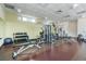 Modern gym featuring various weightlifting machines and free weights for a comprehensive workout routine at 1208 E Kennedy Blvd # 1115, Tampa, FL 33602