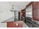 Kitchen island with dark granite countertop and stainless steel appliances at 1208 E Kennedy Blvd # 1115, Tampa, FL 33602