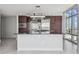 Contemporary kitchen featuring a central island, stainless appliances, and expansive countertops at 1208 E Kennedy Blvd # 1115, Tampa, FL 33602