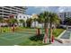 Park with an recreation area featuring mature landscaping, and palm trees at 1208 E Kennedy Blvd # 1115, Tampa, FL 33602