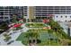 Aerial view of a park with mature trees and green space featuring a tennis court at 1208 E Kennedy Blvd # 1115, Tampa, FL 33602