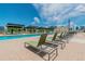 Resort-style pool deck featuring lounge chairs, cabanas, and city skyline views at 1208 E Kennedy Blvd # 1115, Tampa, FL 33602