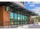 Starbucks storefront with large glass windows, metal awning, and wood-look siding at 1208 E Kennedy Blvd # 1115, Tampa, FL 33602