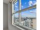 Large window with a bright view of buildings, neighborhood and bright blue sky at 1208 E Kennedy Blvd # 1115, Tampa, FL 33602