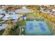 Aerial view of community amenities including a pool, playground, tennis courts, and green spaces at 12112 Feldwood Creek Ln, Riverview, FL 33579