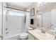 Bright bathroom featuring a shower-tub combo with white tile surround and neutral wall paint at 12112 Feldwood Creek Ln, Riverview, FL 33579