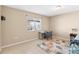 Serene bedroom with tile flooring, a bright window, and a cozy rug to accent the space at 12112 Feldwood Creek Ln, Riverview, FL 33579