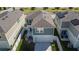 An aerial view highlights a two-story home with a fenced yard and a patio area perfect for outdoor enjoyment at 12818 Crested Iris Way, Riverview, FL 33579