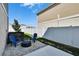 Backyard patio featuring a stone fire pit and blue Adirondack chairs, perfect for outdoor relaxation at 12818 Crested Iris Way, Riverview, FL 33579