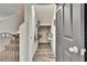 Storage closet under the stairs, with shelves and a hardwood-style floor at 12818 Crested Iris Way, Riverview, FL 33579