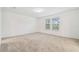 Carpeted bedroom with natural light from the home's windows at 13729 Evergreen Valley Dr, Riverview, FL 33578