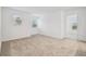 Bright bedroom featuring neutral carpeting and plenty of natural light at 13729 Evergreen Valley Dr, Riverview, FL 33578