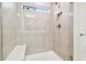 Contemporary shower with sleek tile, glass enclosure, and built-in niche at 13729 Evergreen Valley Dr, Riverview, FL 33578