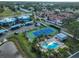 Aerial view showcasing the tennis court and community swimming pool at 14505 Catalina Cir, Seminole, FL 33776